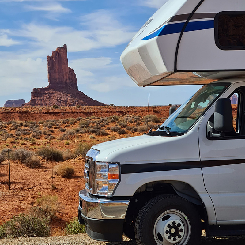 RV parked in front of mountains