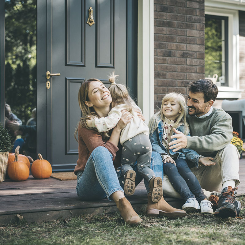 A family sitting on their porch