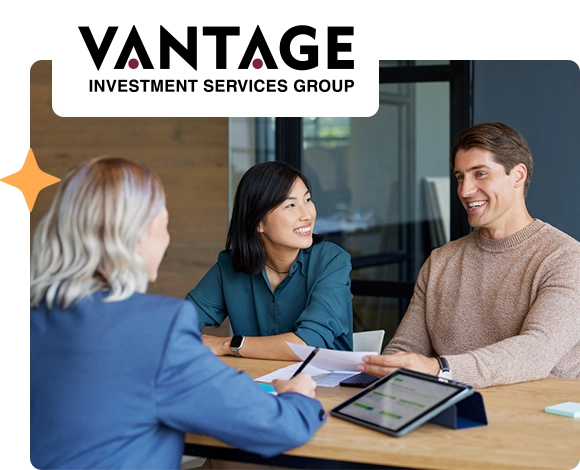 A couple working with a Vantage employee on their investments