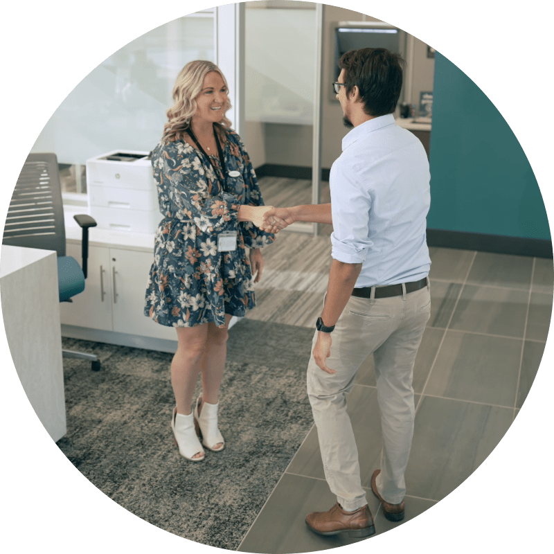 A Vantage employee shaking a customers hand