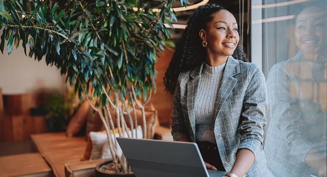 A female professional working on her laptop
