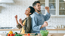 Couple dancing in kitchen
